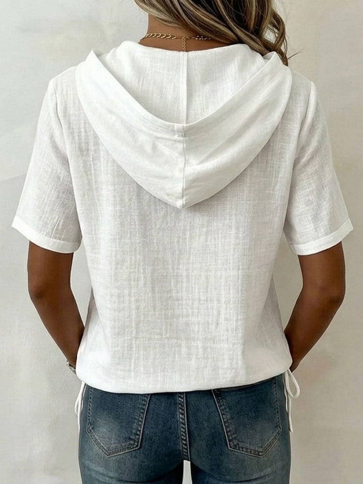 Versatile women's casual hooded shirt with button-up front in a comfortable relaxed fit.
