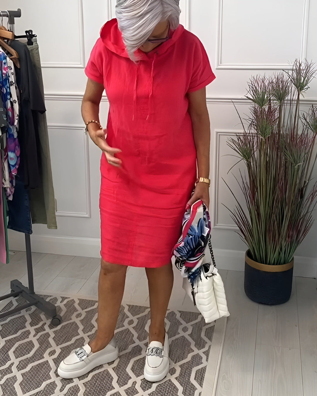 Stylish women's casual hoodie midi dress, offering a relaxed fit for everyday comfort.