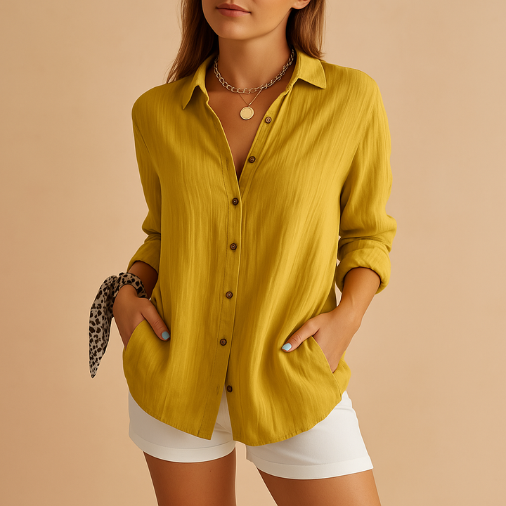 Comfortable women's relaxed fit long sleeve button-up blouse, ideal for casual or workwear.