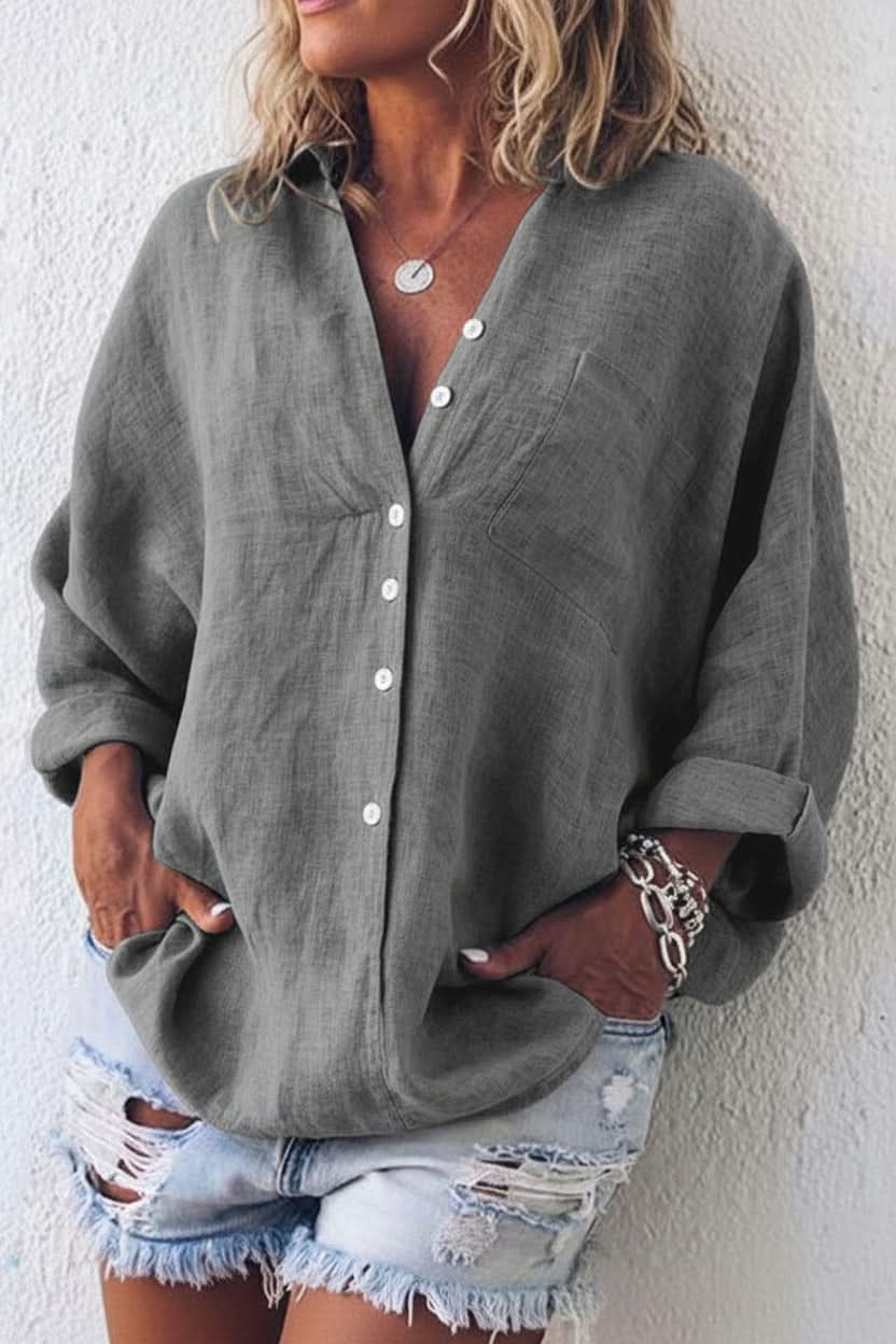 Elegant women's long sleeve top with a relaxed fit and stylish open back, perfect for chic casual wear.