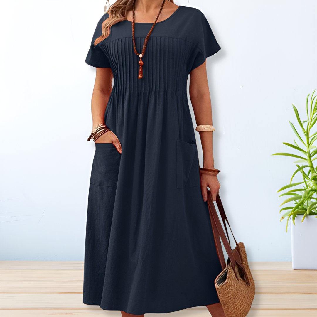Comfortable women's short sleeve midi day dress with pockets. Ideal relaxed fit for casual spring and summer days.
