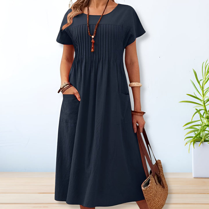 Comfortable women's short sleeve midi day dress with pockets. Ideal relaxed fit for casual spring and summer days.