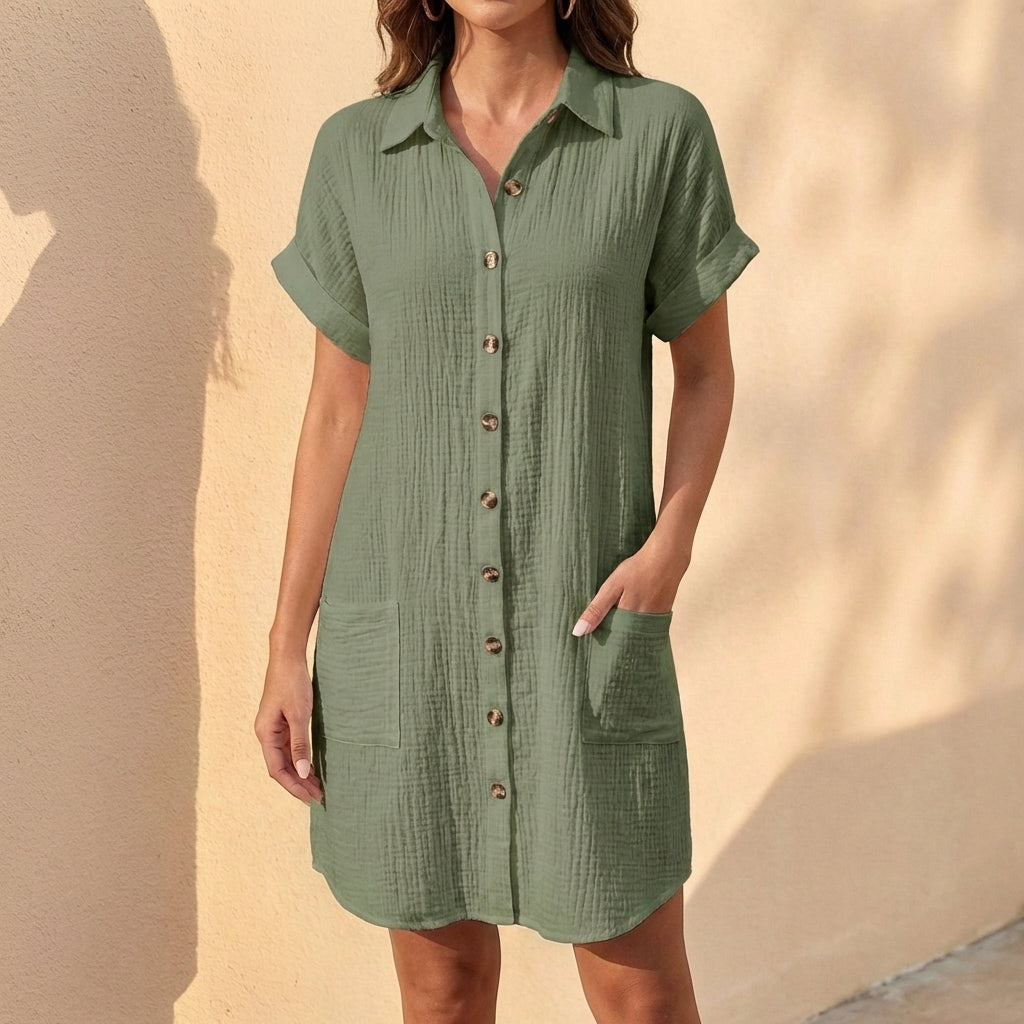 Women's relaxed fit midi shirt dress with cuffed short sleeves, button front, and collar. Ideal summer casual.