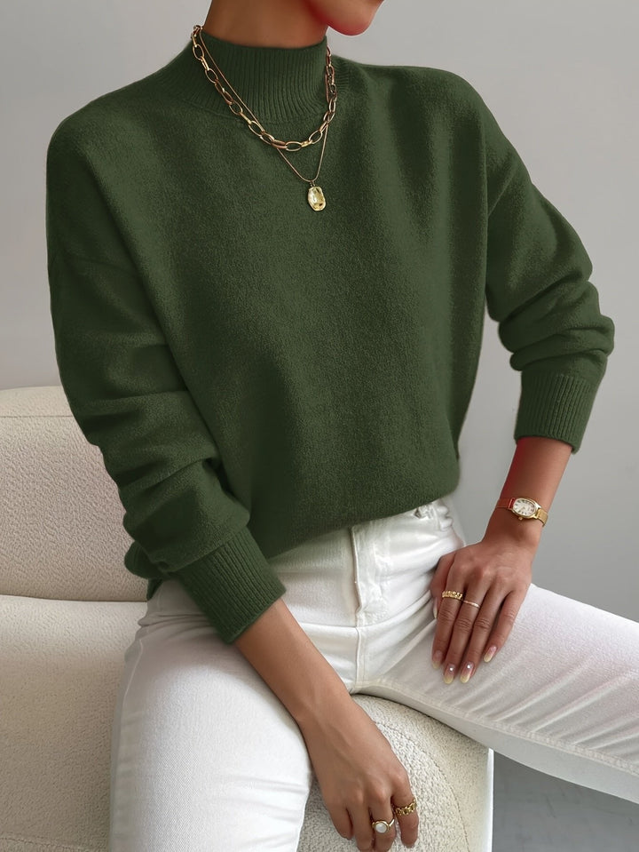 Relaxed fit women's mock turtleneck sweater, long sleeve. Effortlessly chic and comfortable for any season.