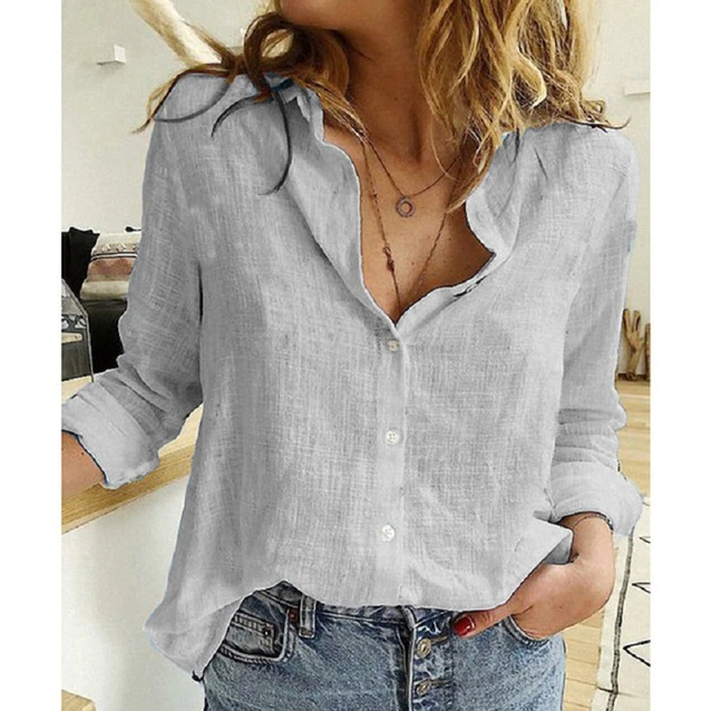 Elegant women's relaxed fit blouse with point collar & button down, a stylish year-round top.