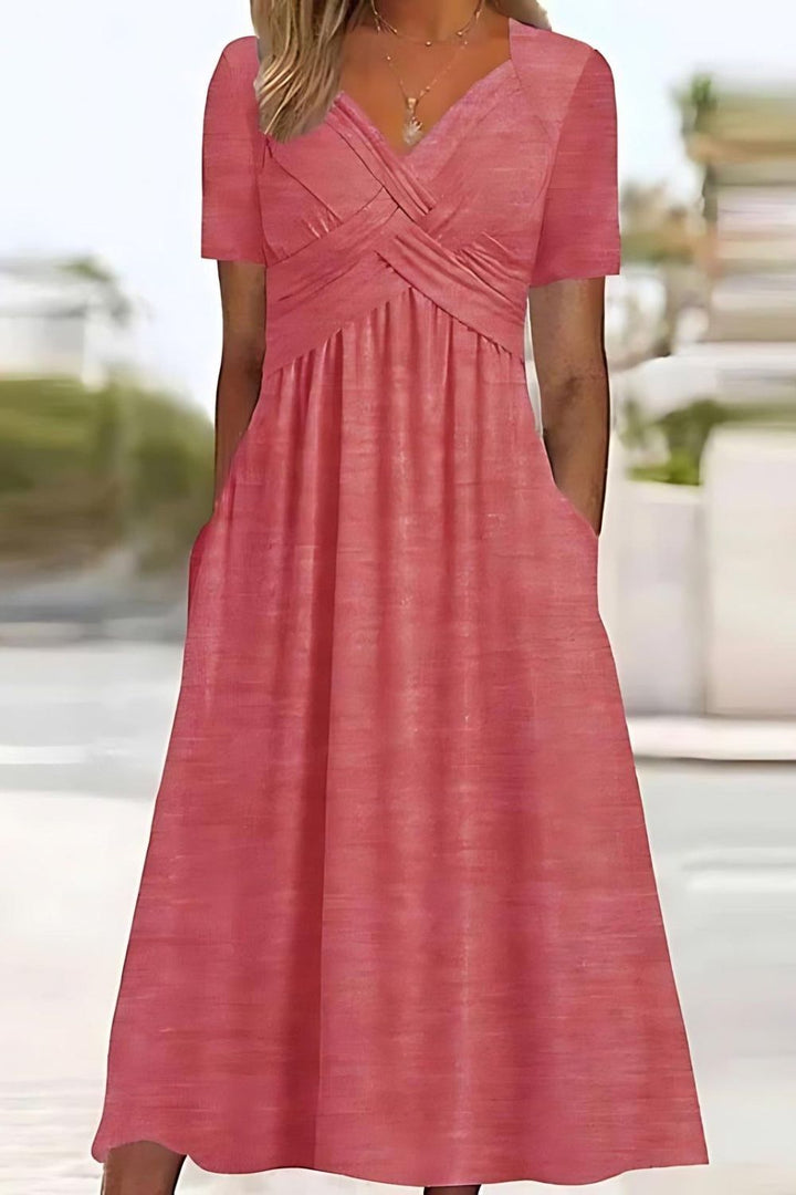 Flowing women's relaxed fit midi dress featuring a stylish print, offering comfort for spring and summer days.
