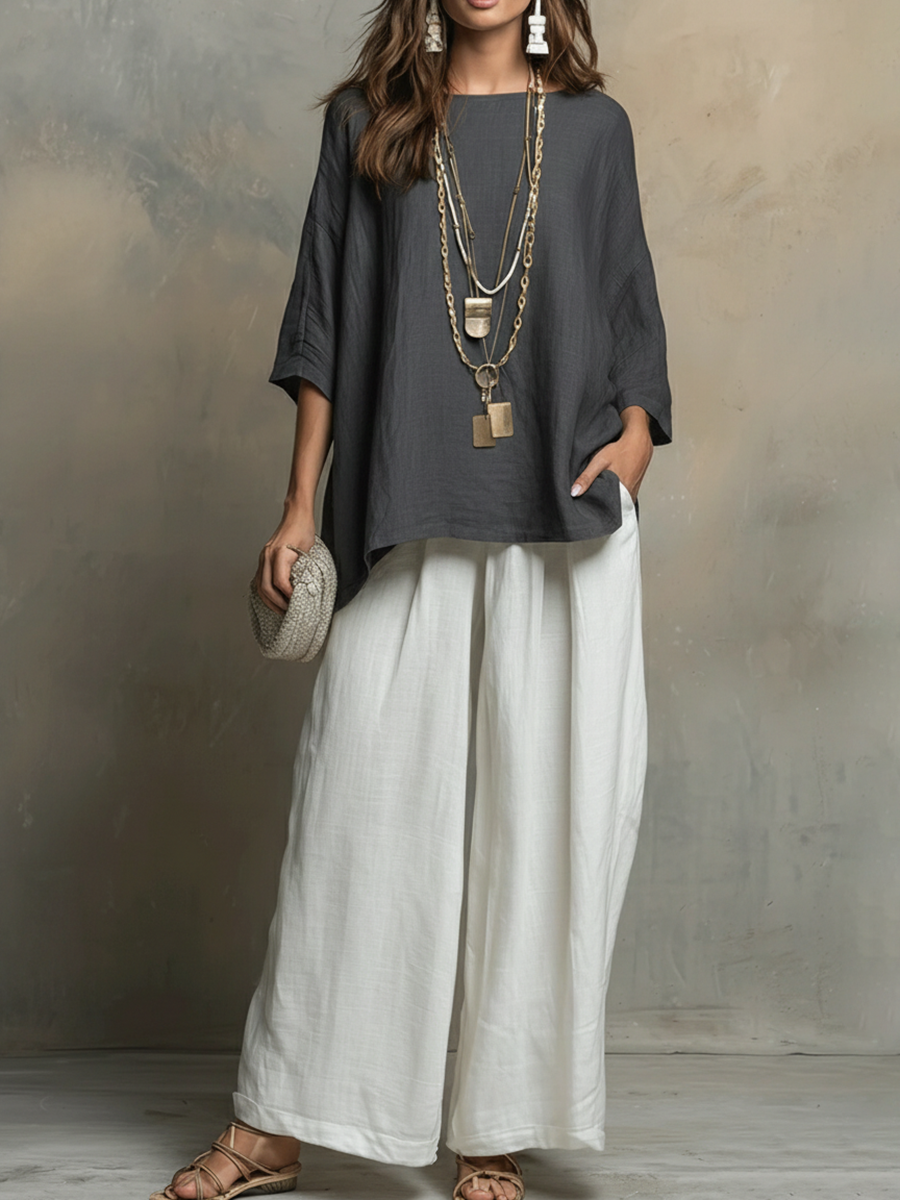 Stylish women's matching set featuring a relaxed fit shirt and wide-leg pants for a chic casual summer look.