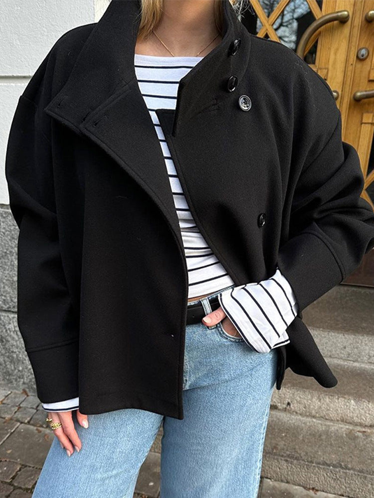Stylish women's relaxed fit short coat, ideal for casual wear. High neck and secure button closure provide warmth.