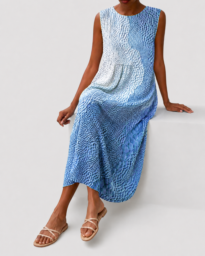 Sleeveless, relaxed fit, knee-length casual dress for women. Features pockets, perfect for comfortable daily wear.