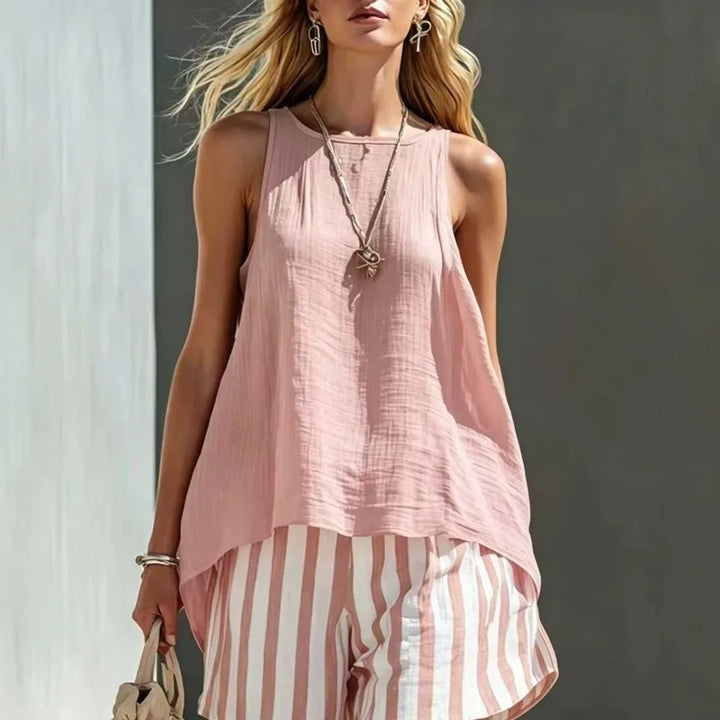 Effortless women's relaxed sleeveless top and matching striped shorts set, great for warm weather fashion.