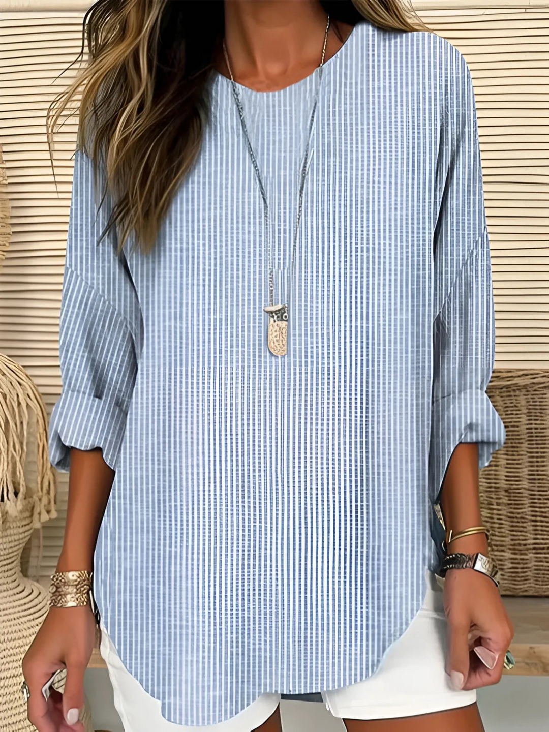 Women's relaxed fit striped long sleeve blouse for comfortable, chic everyday style. Versatile casual top.