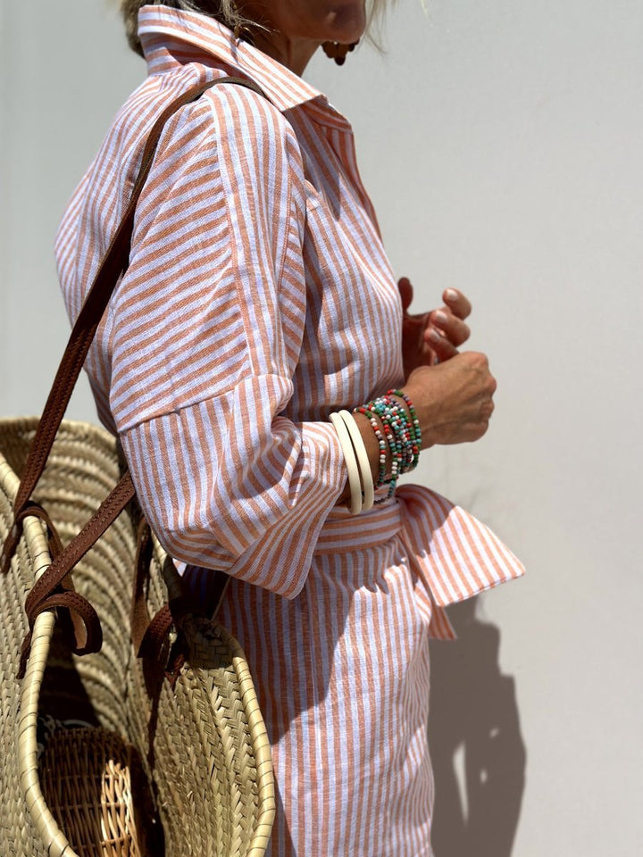 Grey striped button front shirt dress for women, a comfortable relaxed fit midi dress for any casual occasion.