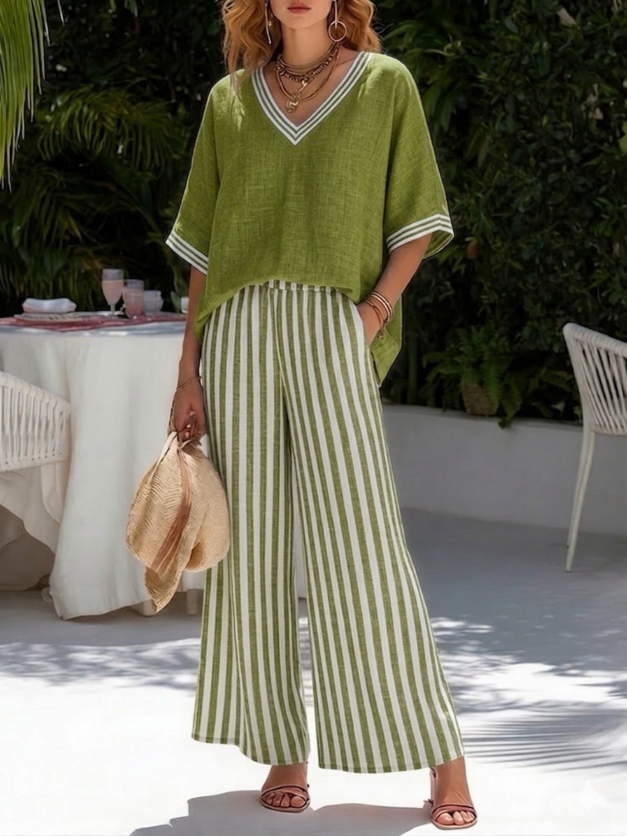 Cozy women's striped two-piece loungewear set with a relaxed fit V-neck shirt and comfortable wide leg pants.