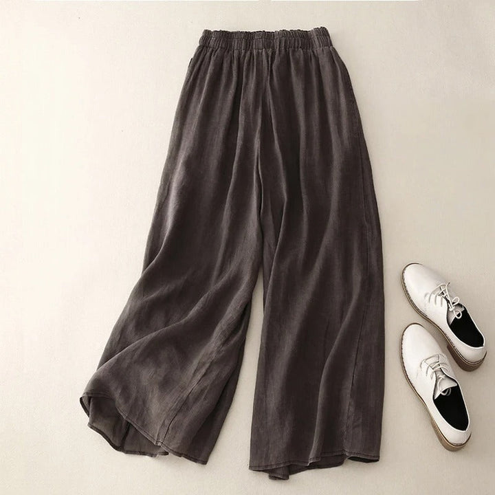 Woman wearing comfortable relaxed fit trousers with loose waistband, ideal for everyday casual summer fashion.