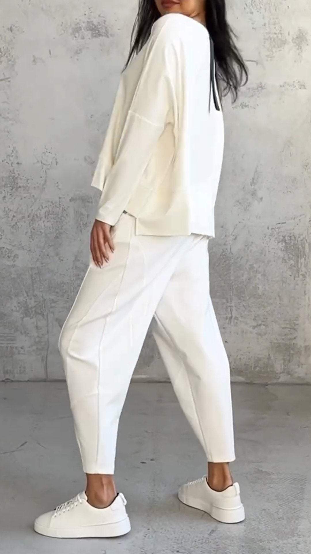 Model wearing a comfortable women's relaxed fit loungewear set, suitable for casual wear.