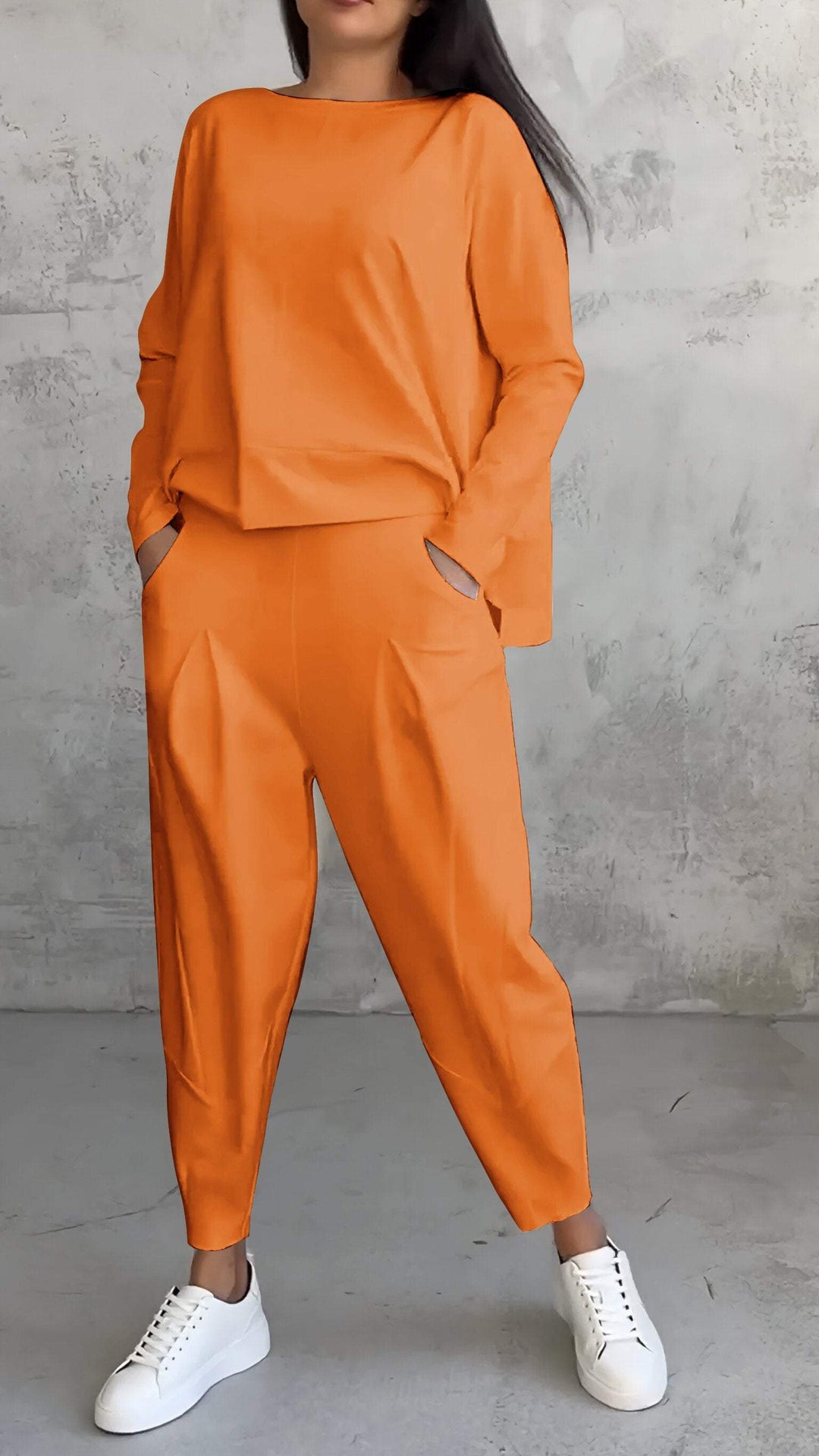 Elegant women's two-piece casual outfit with a relaxed fit, embodying comfort and modern style.