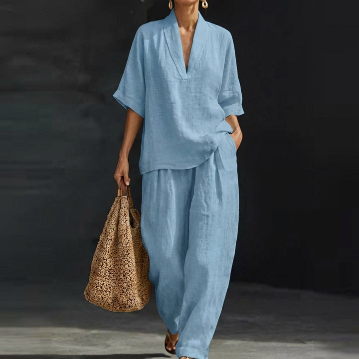 Women's relaxed fit two-piece set featuring a comfortable V-neck top & wide-leg pants. Perfect casual chic outfit.