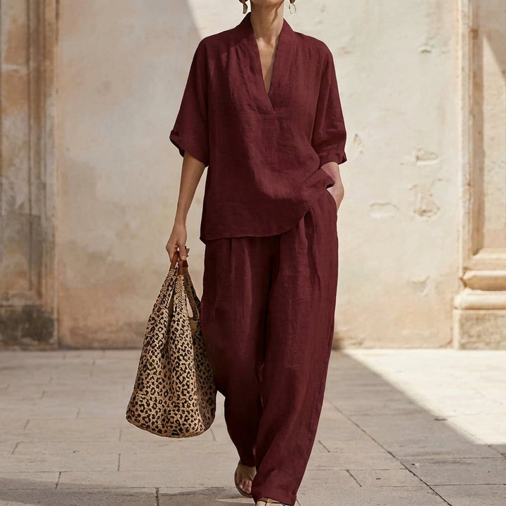 Comfortable women's two-piece set: relaxed V-neck top & wide-leg pants. Ideal for travel or casual everyday wear.