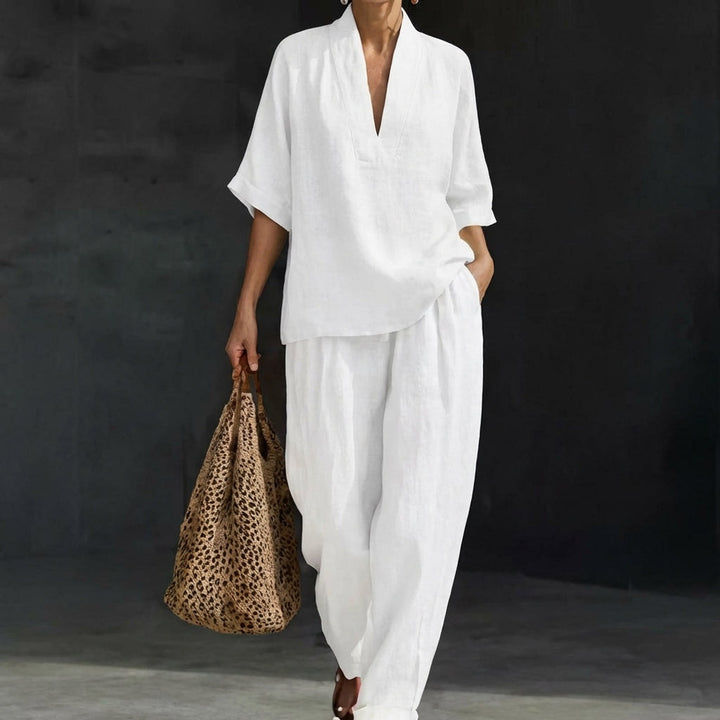 Women's two-piece outfit: relaxed V-neck top paired with comfortable wide-leg pants. Effortless matching set.