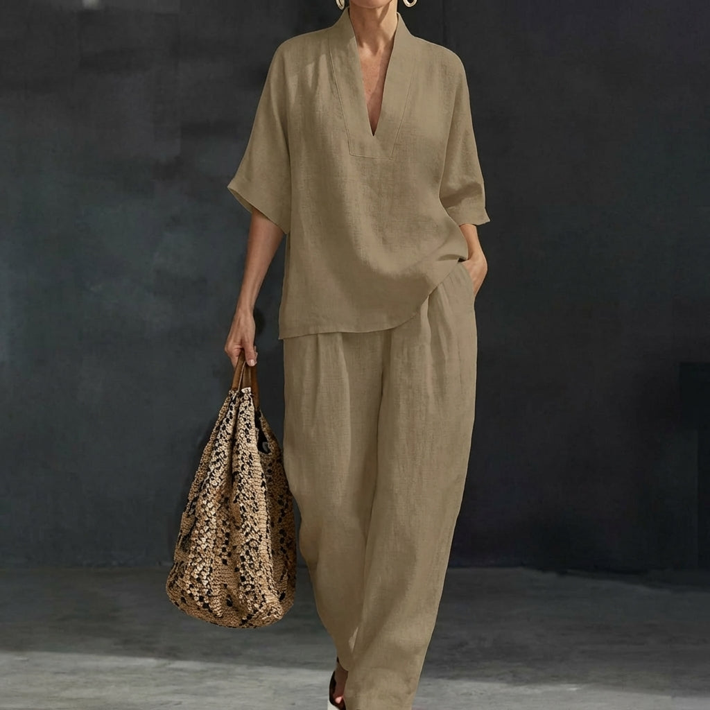 Casual chic women's two-piece set with a relaxed V-neck top and flowy wide-leg pants. A comfortable matching outfit.
