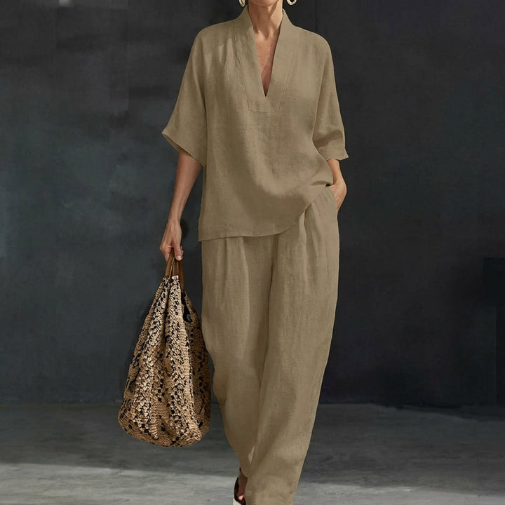 Casual chic women's two-piece set with a relaxed V-neck top and flowy wide-leg pants. A comfortable matching outfit.