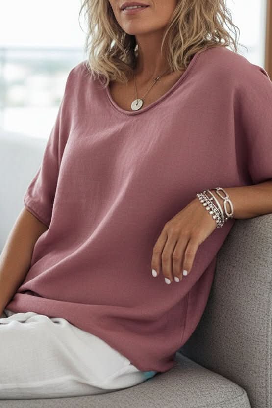 Fashionable women's relaxed fit V-neck summer top, comfortable & stylish for daily wear.