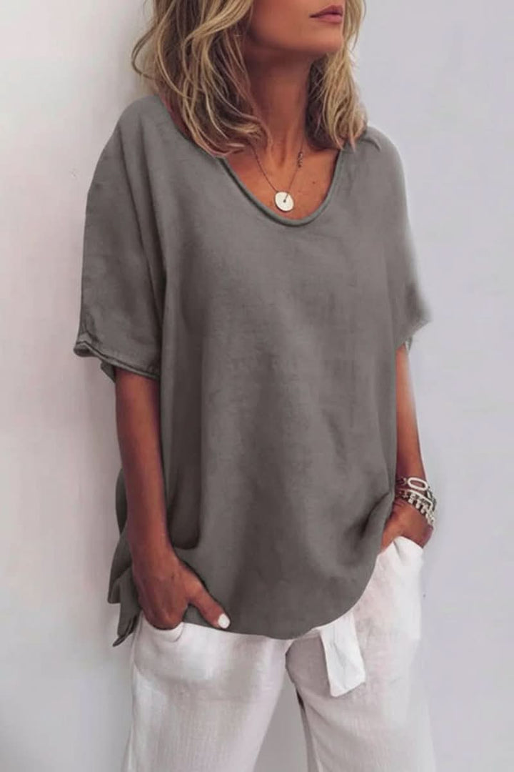Relaxed fit V-neck blouse for women, a comfortable and airy summer top for casual styling.