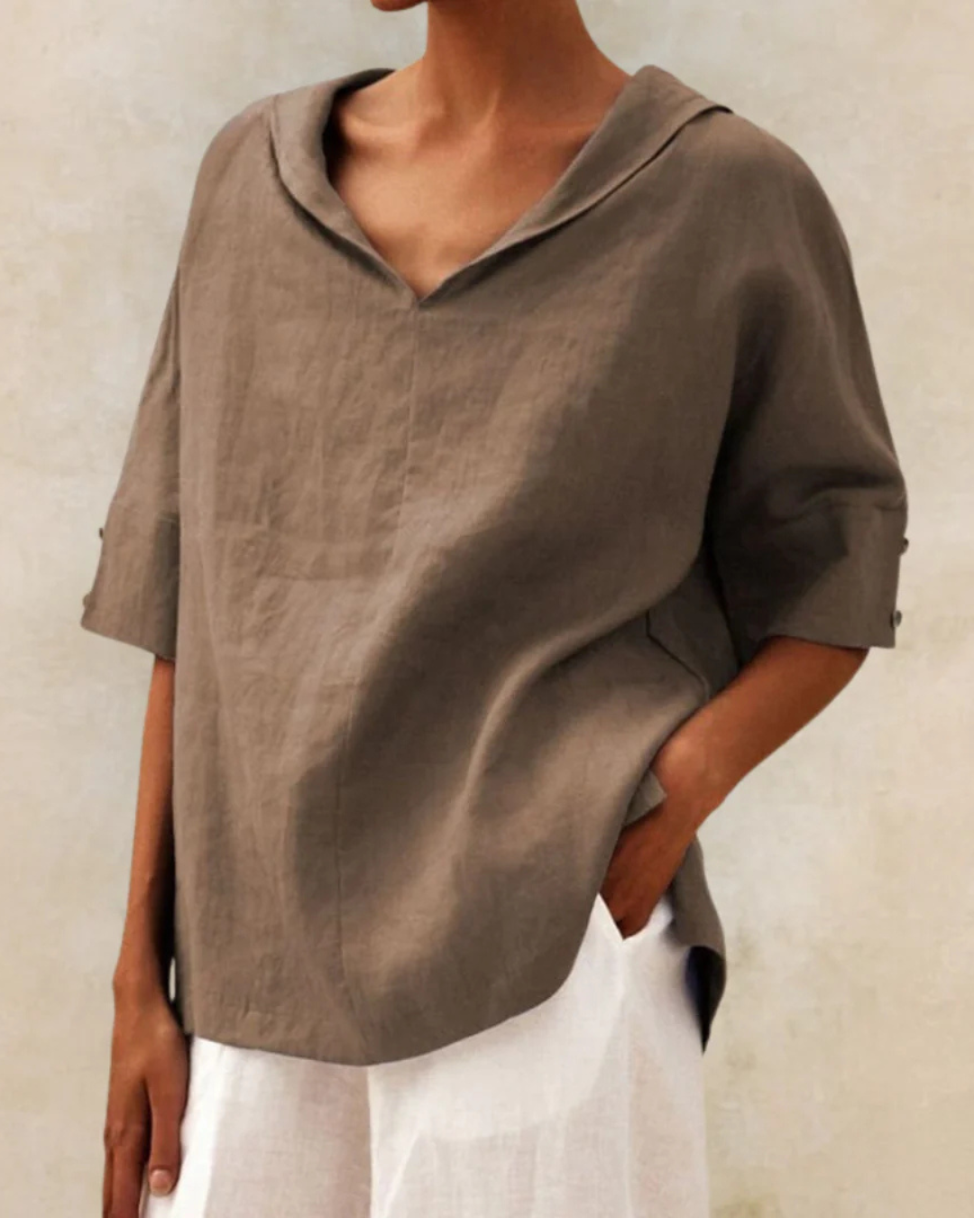 Effortless women's short sleeve V-neck blouse. Relaxed fit design ensures maximum comfort for versatile casual wear.