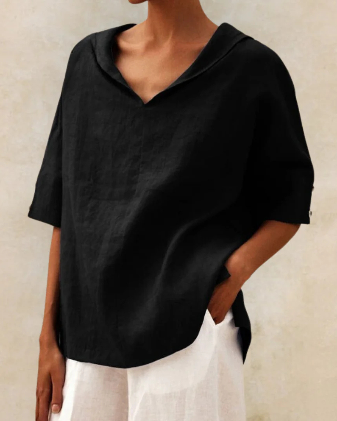 Soft women's relaxed fit V-neck blouse, short sleeves. Enjoy everyday comfort & versatile style for casual outings.