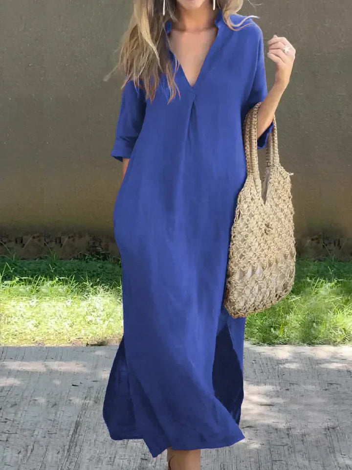 Elegant women's V-neck maxi dress with a relaxed fit, 3/4 sleeves, and a flattering side slit.