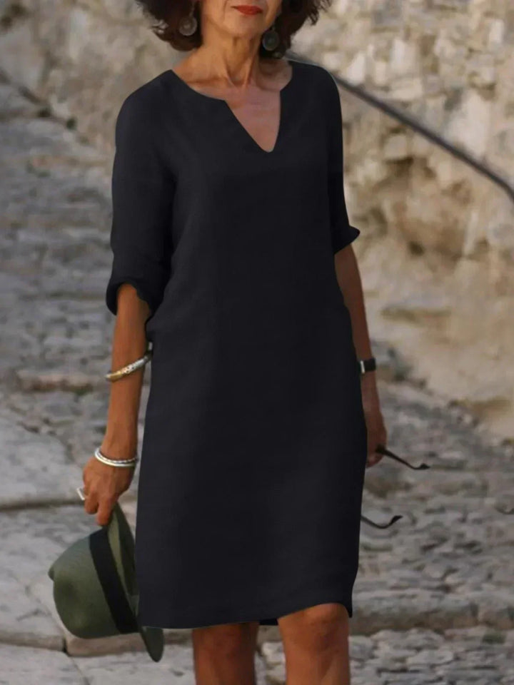 Comfortable women's 3/4 sleeve V-neck midi dress. Ideal versatile piece for summer, travel, and everyday fashion.