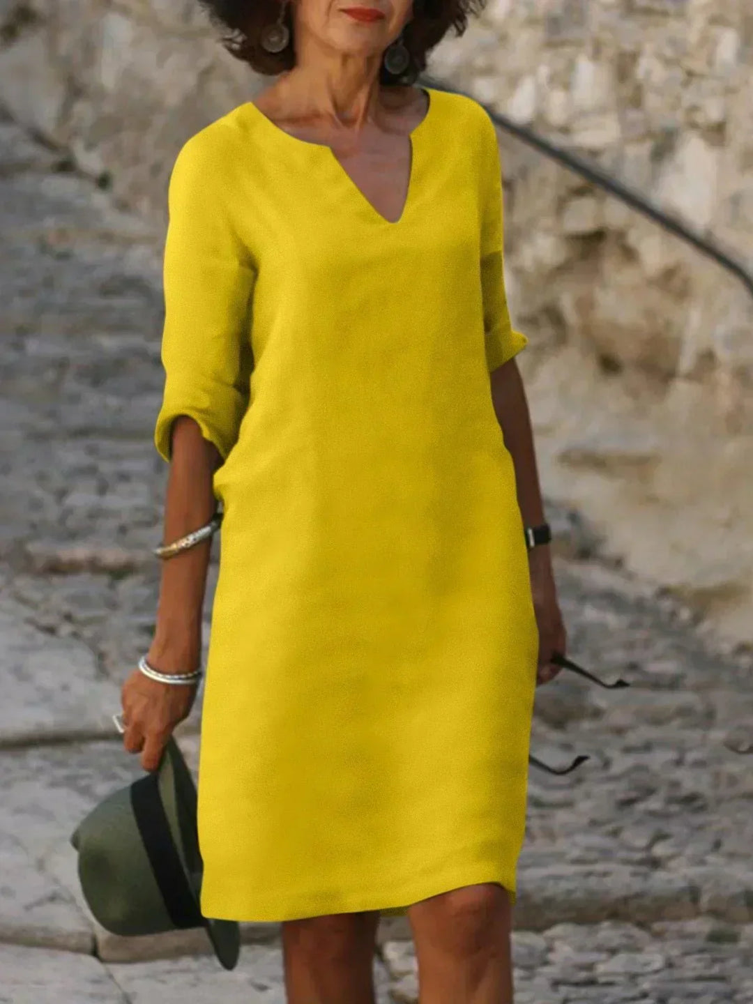 Effortlessly chic women's 3/4 sleeve V-neck midi dress. Relaxed fit design for comfortable, stylish everyday fashion.