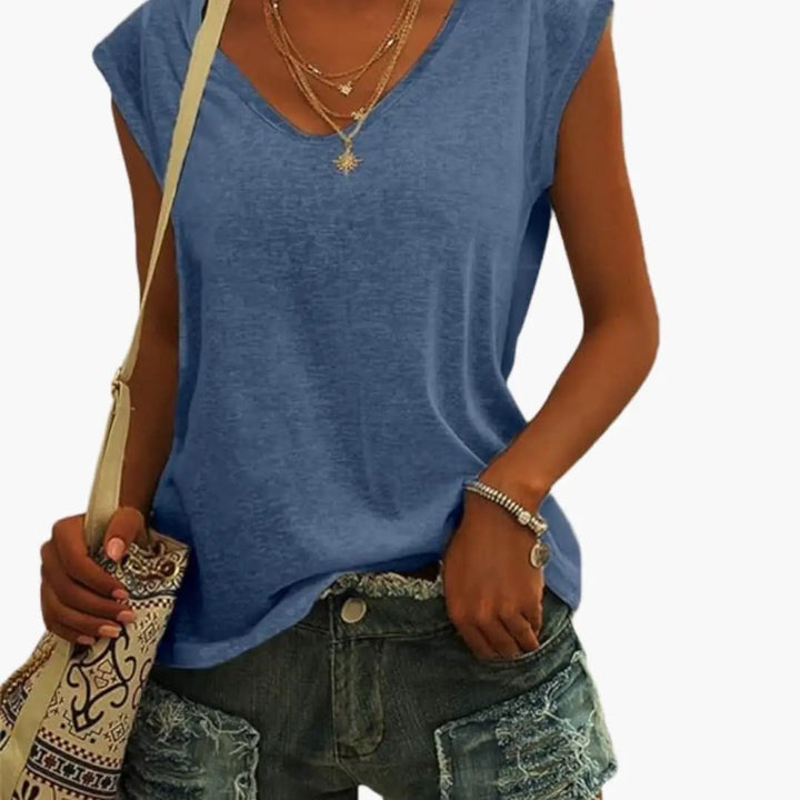 Chic women's V-neck sleeveless top with a relaxed fit, ideal for versatile everyday fashion & summer style.