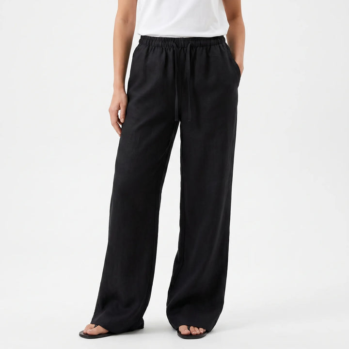 High-waisted women's wide-leg flowy pants in a relaxed fit, ideal for casual summer style and comfort.