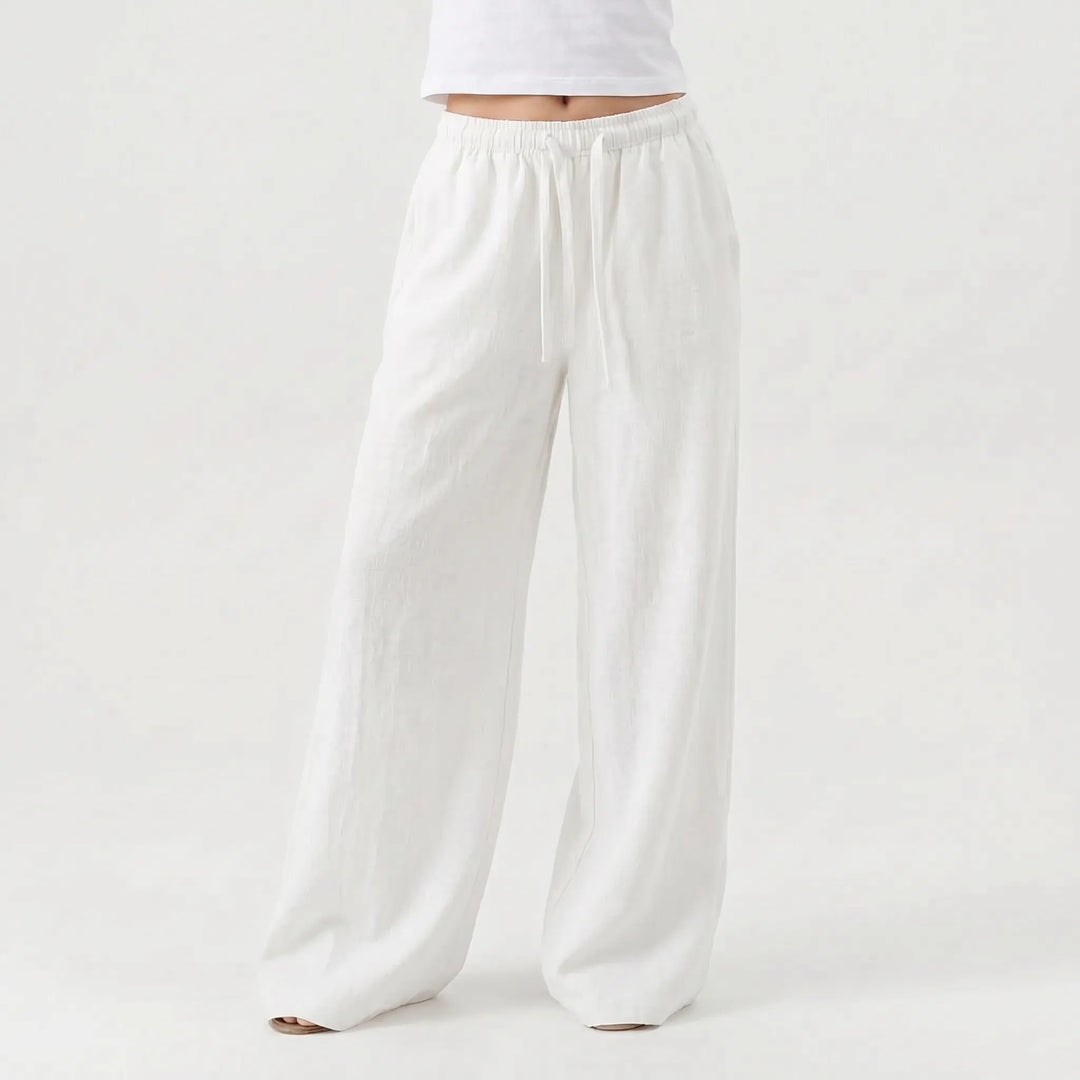 Stylish women's relaxed wide-leg casual pants, high-waisted design with flowy fabric, great for summer comfort.
