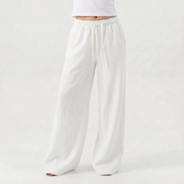 Stylish women's relaxed wide-leg casual pants, high-waisted design with flowy fabric, great for summer comfort.