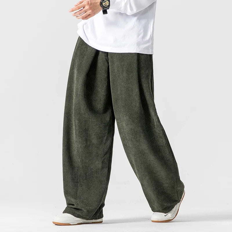 Women's relaxed fit wide-leg trousers with drawstring waist. Comfortable, stylish everyday casual pants.