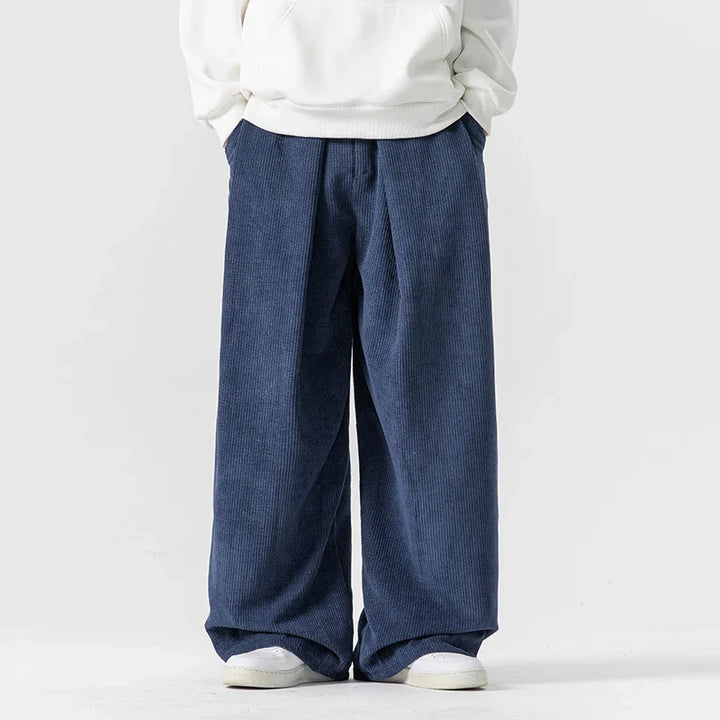 Women's relaxed fit wide leg trousers, featuring a comfortable drawstring waist. Ideal for a retro 90s look.