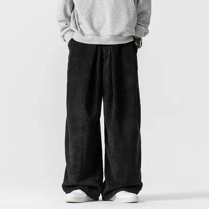 Stylish women's relaxed fit trousers with wide legs and a comfortable drawstring waist. Perfect for casual wear.