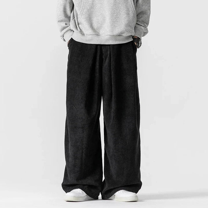 Stylish women's relaxed fit trousers with wide legs and a comfortable drawstring waist. Perfect for casual wear.