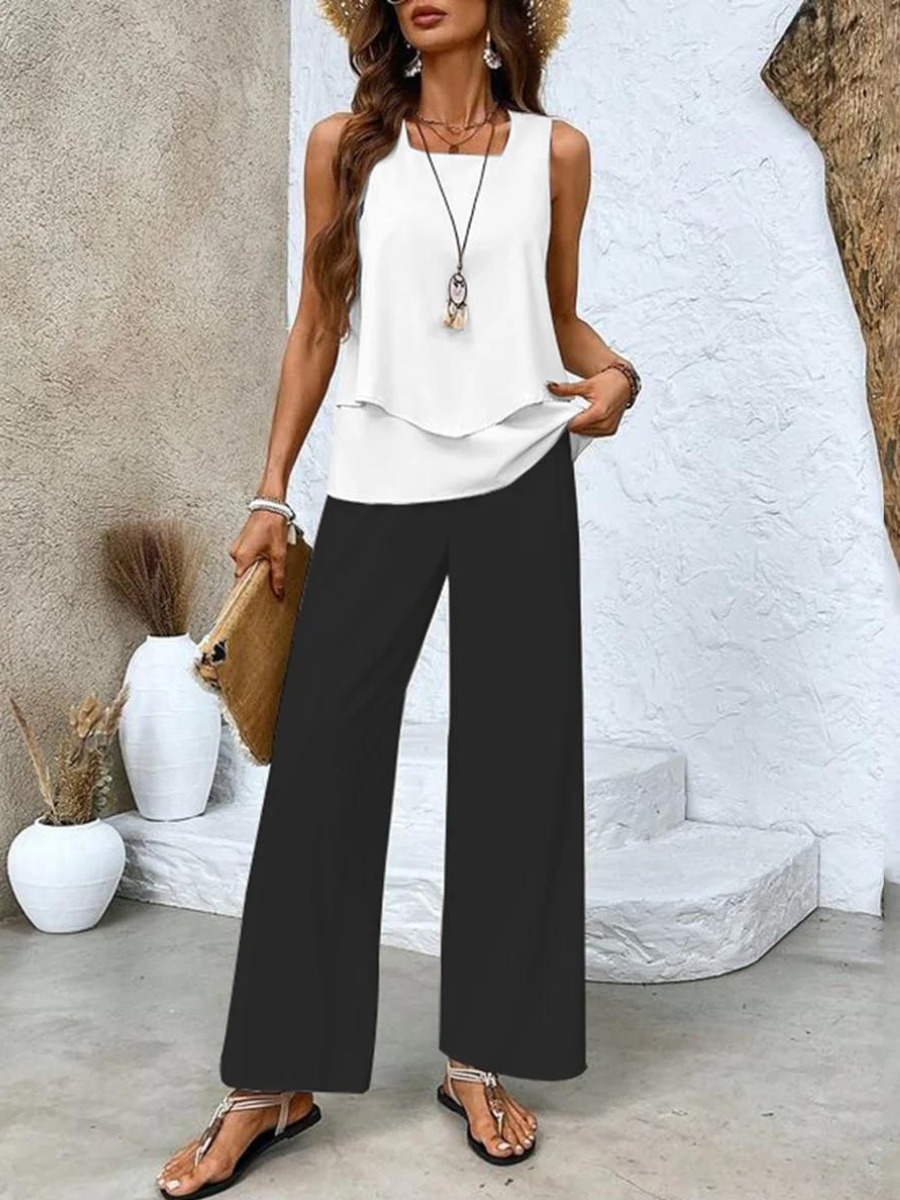 Stylish women's matching set with a relaxed flowy tank top and wide-leg pants for summer comfort.