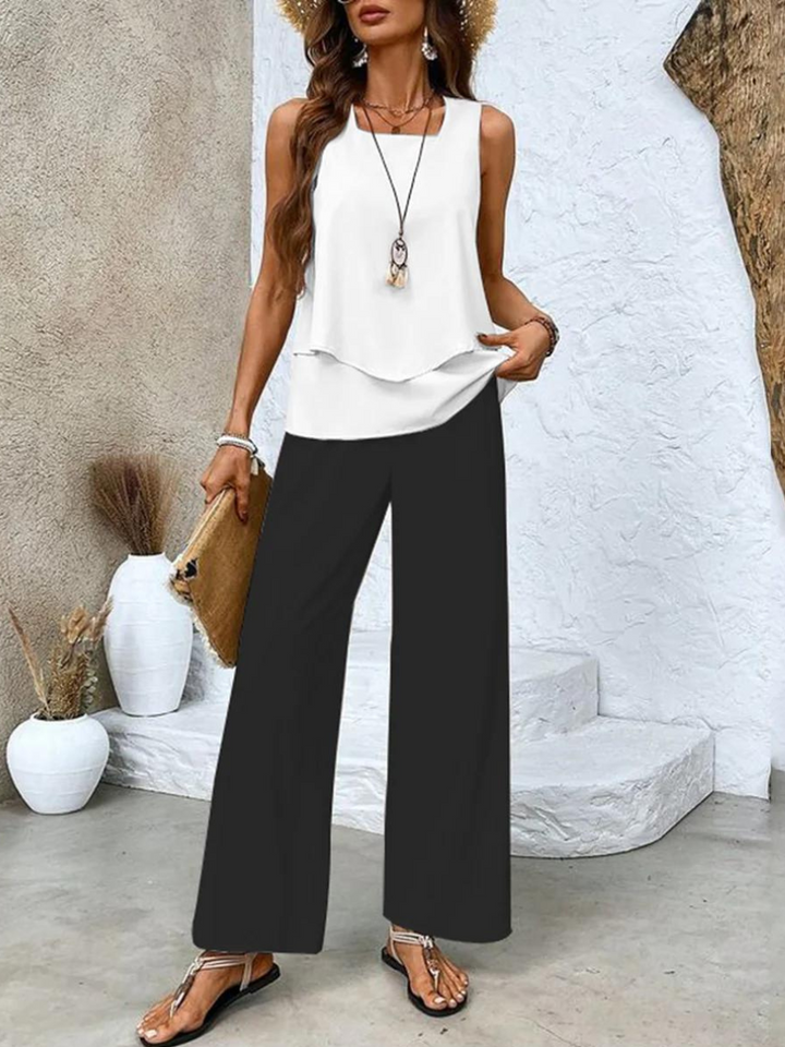 Stylish women's matching set with a relaxed flowy tank top and wide-leg pants for summer comfort.