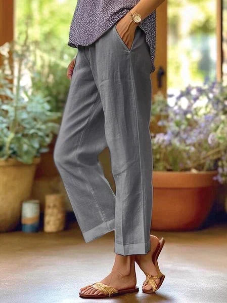 Stylish women's relaxed straight-leg casual pants with side pockets, perfect for spring and summer everyday wear.