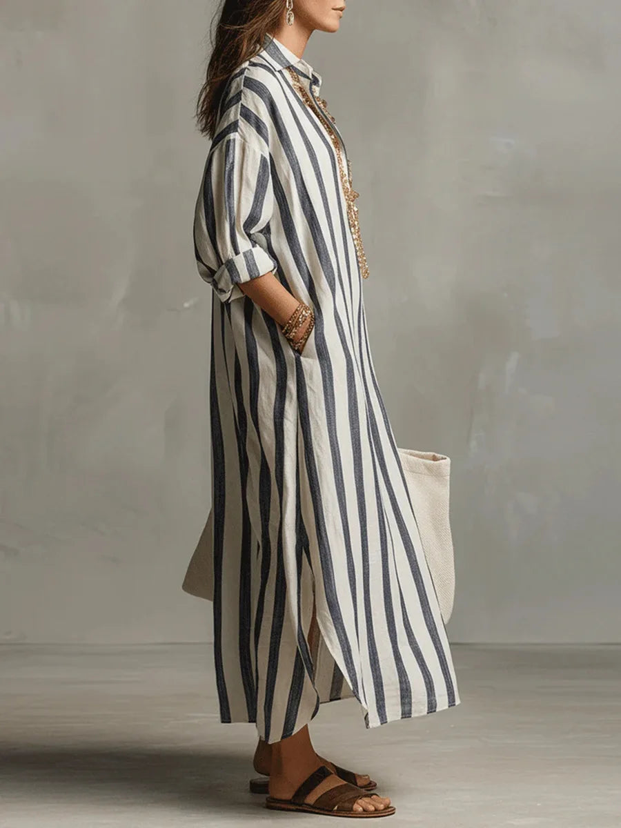 Flowy striped maxi dress for women, featuring a relaxed fit, V-neck, and three-quarter sleeves. Comfortable.