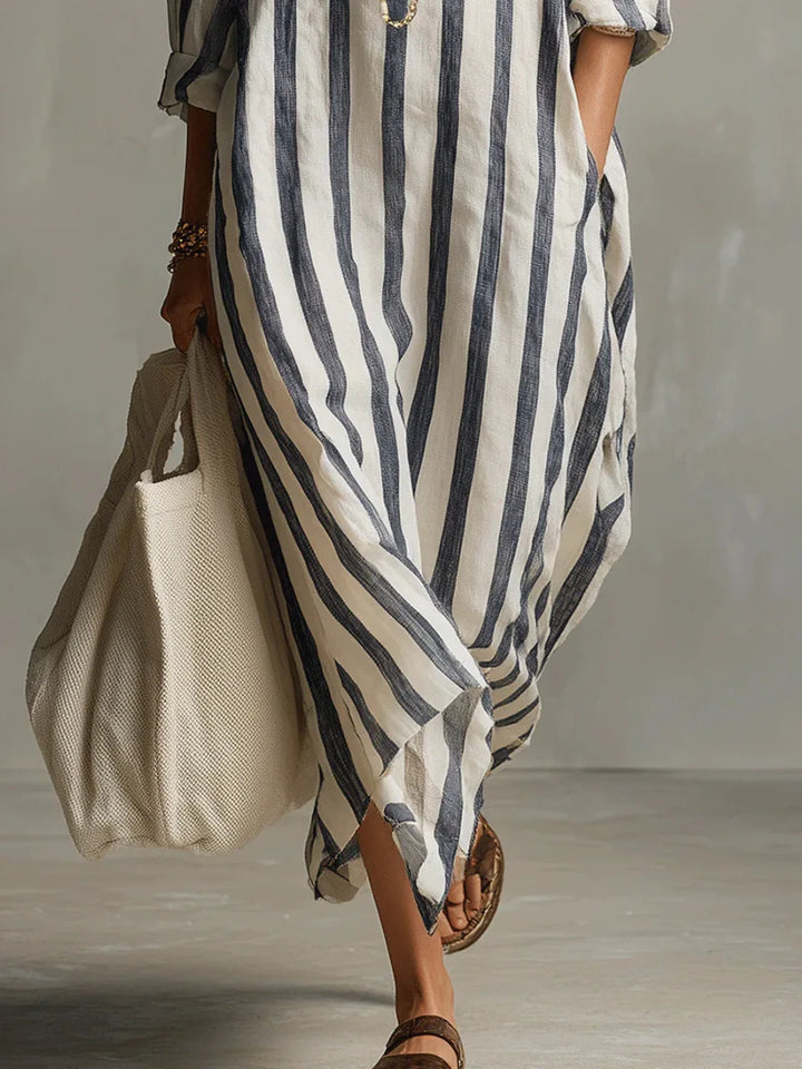 Comfortable women's long striped maxi dress with a V-neck collar, great for vacation and relaxed daily wear.