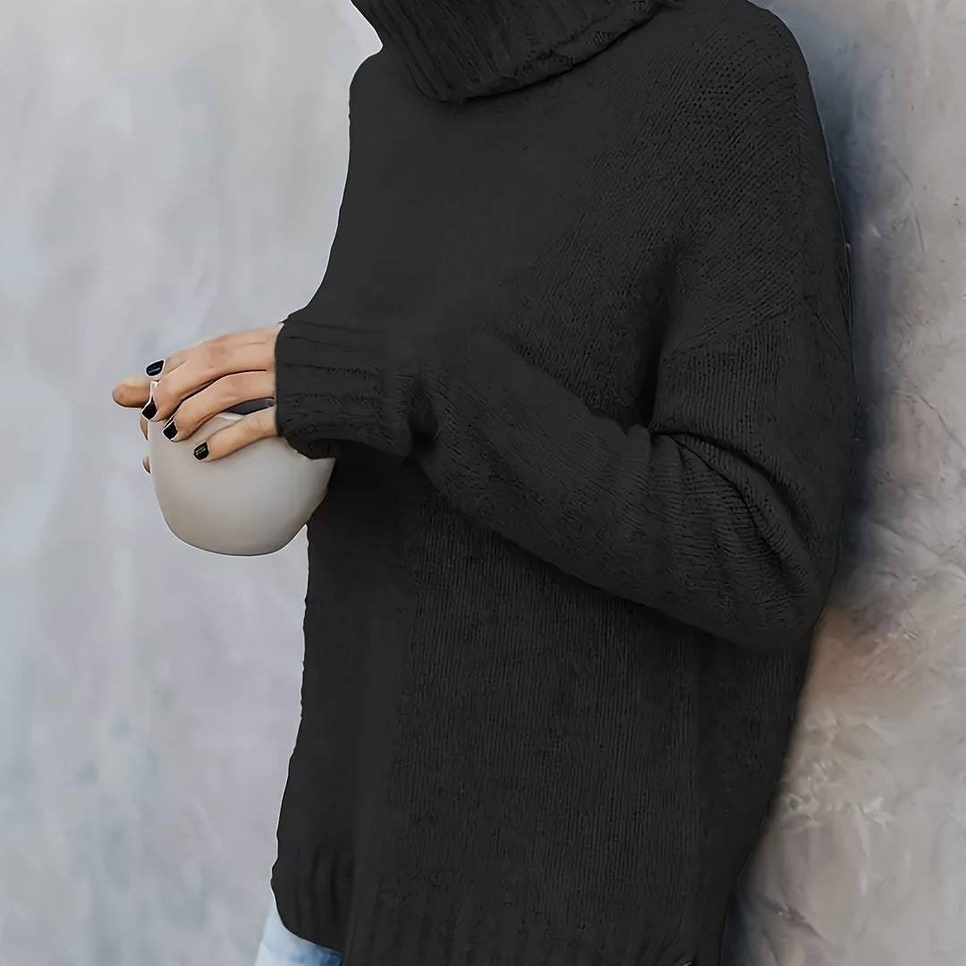 Comfortable women's turtleneck top, relaxed and long-sleeved, featuring a modern side split hem.