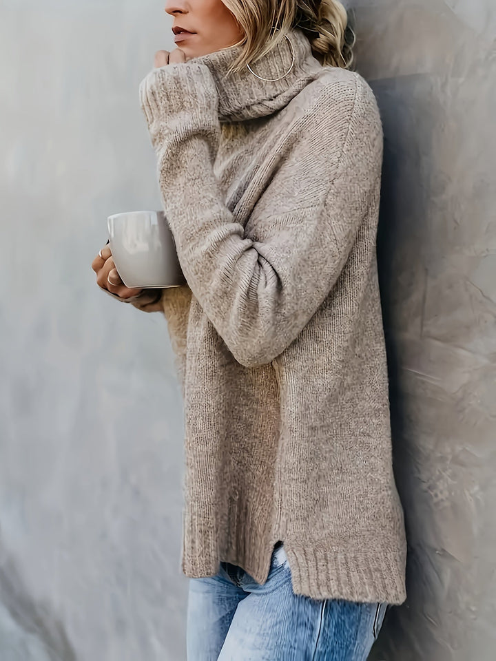 Soft women's relaxed fit sweater with a warm turtleneck and trendy split hem for fall style.