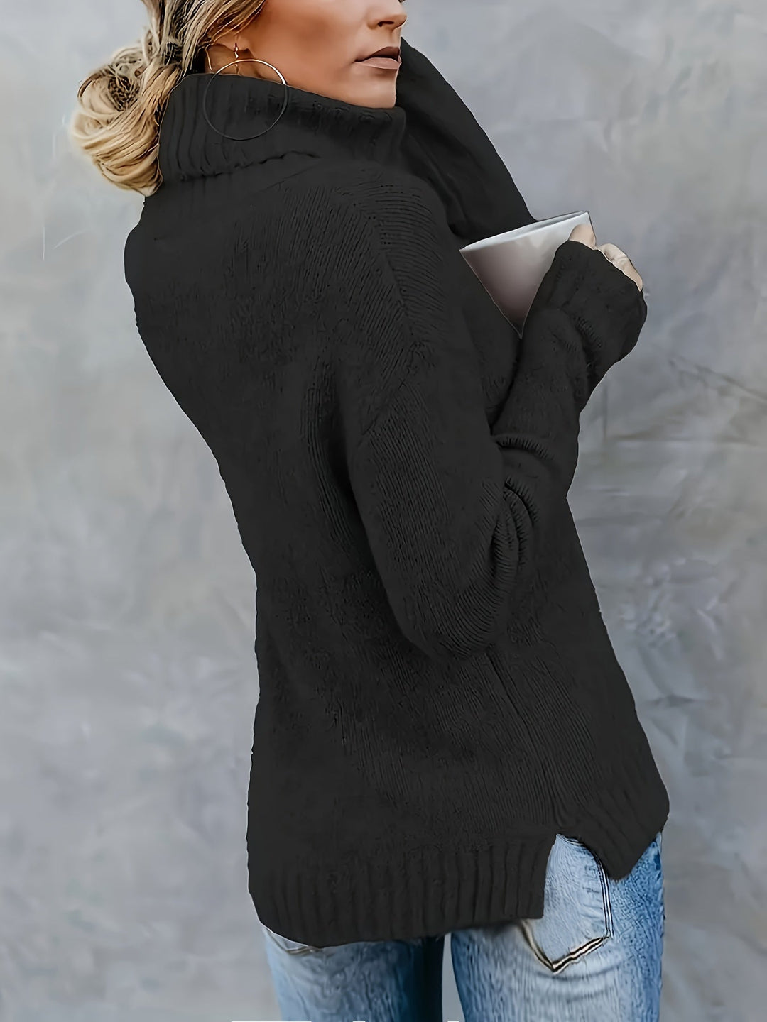 Everyday comfort: women's long sleeve turtleneck sweater with a modern side split hem detail.