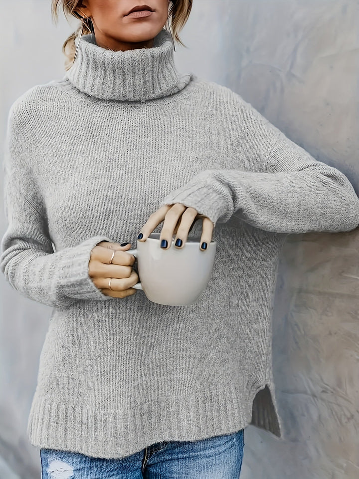 Chic women's relaxed turtleneck jumper, designed with a flattering side split hem for fall fashion.
