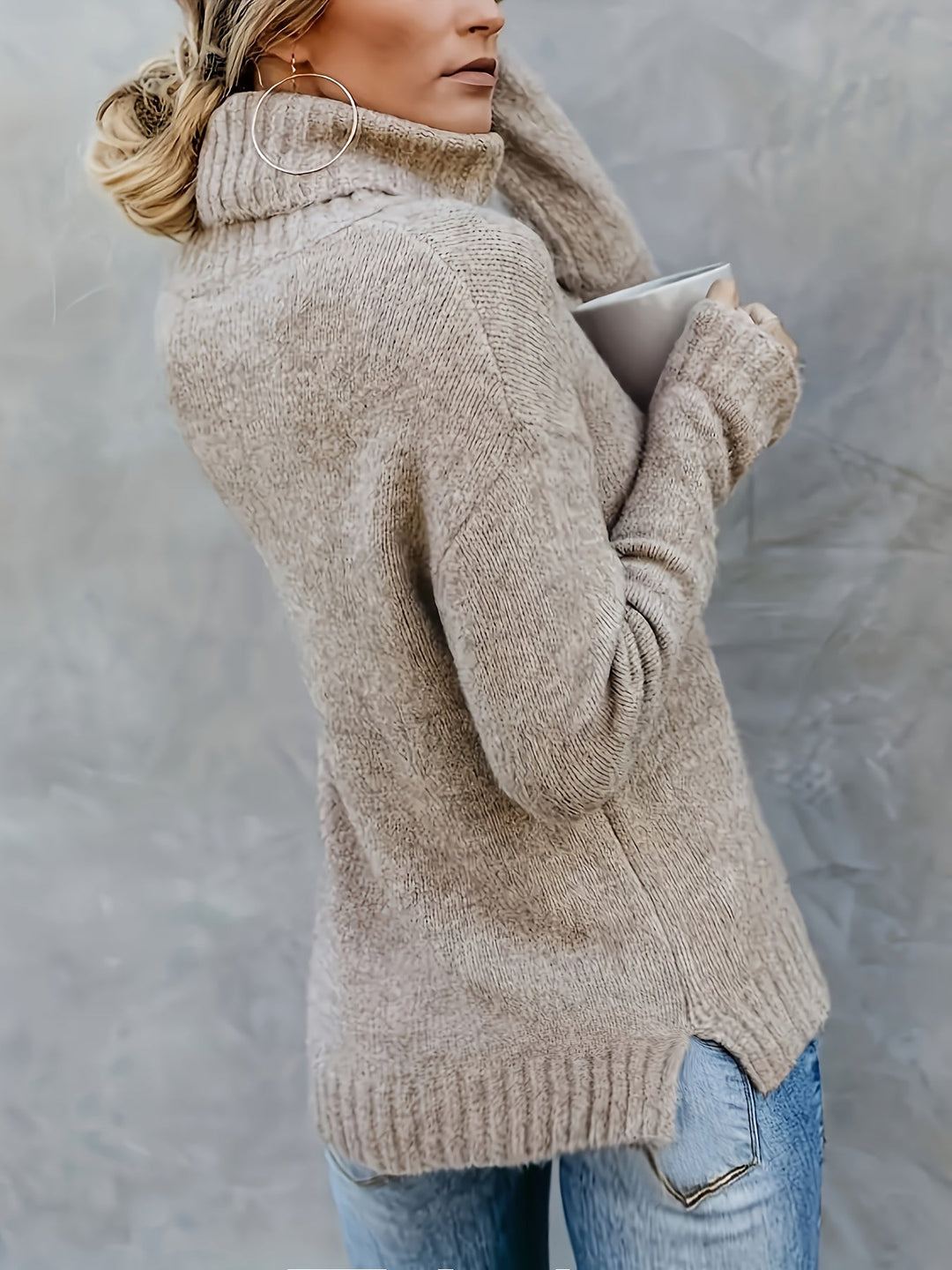 Warm winter women's turtleneck sweater, relaxed fit with a stylish split hem, perfect for layering.